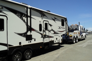 heavy tow truck towing a camper van