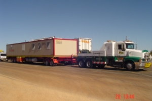 heavy tow truck recovering mobile accommodation unit