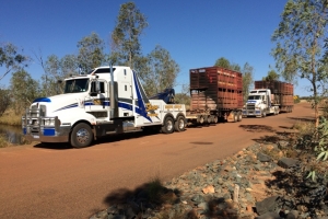 tow truck transporting a heavy load