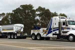 heavy tow truck towing a heavy load