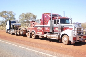 heavy tow truck towing a broken down truck