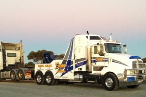 heavy tow truck towing a truck