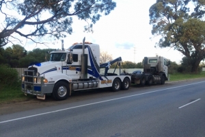heavy tow truck towing a truck